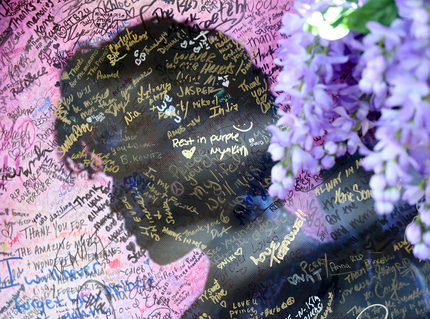 A painting with signatures of Prince fans who visited the site outside Paisley Park Saturday May 14, 2016, in Chanhassesn, MN.](DAVID JOLES/STARTRIBUNE)djoles@startribune In the days and weeks that have passed since the death of Prince Rogers Nelson, the memorial outside his residence and work place at Paisley Park has both grown largely and also begun to weather. Some of the items left behind from loving, appreciative and sad fans are pictured here. Some of the items were photographed using a t