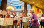 In this file photo from May 18, 2018, relatives of elder abuse victims gathered outside the House Chamber Friday to protest inaction by the state Legi