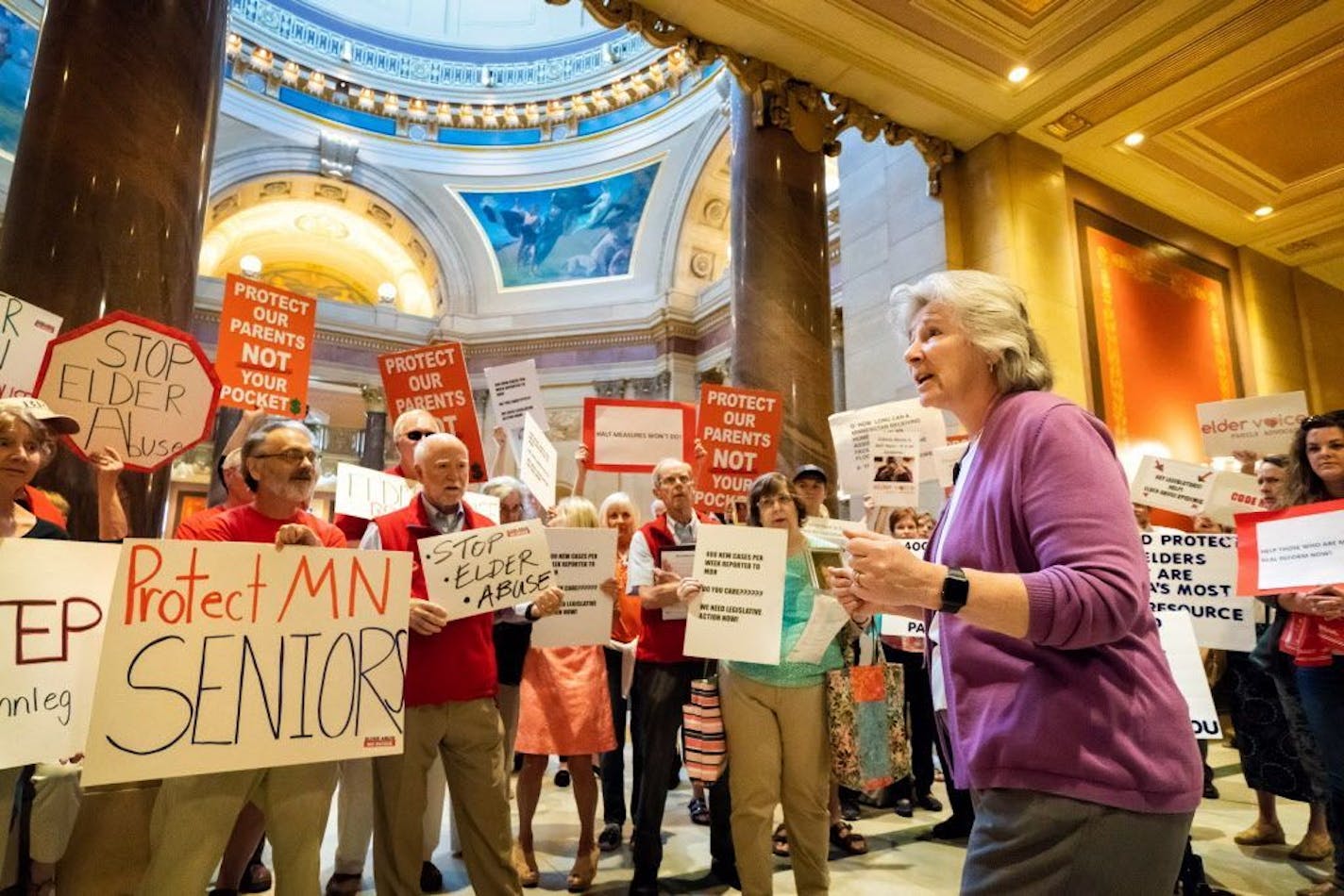 In this file photo from May 18, 2018, relatives of elder abuse victims gathered outside the House Chamber Friday to protest inaction by the state Legislature over proposals that would have protected seniors from abuse. Health Commissioner Jan Malcolm thanked them for their efforts.