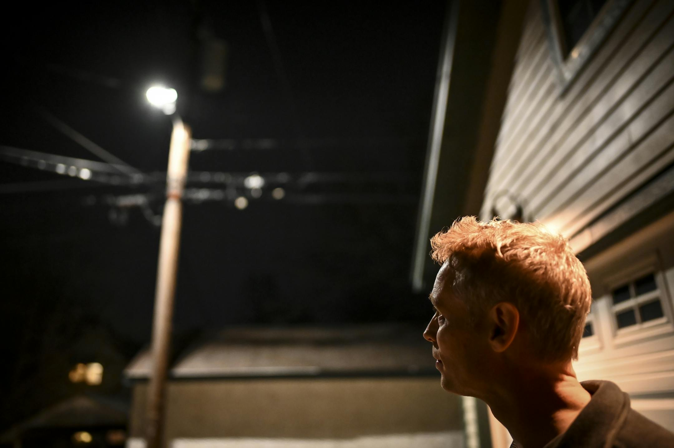 Scott Barkman looked up at the new LED streetlight in the alley behind his home Thursday night.