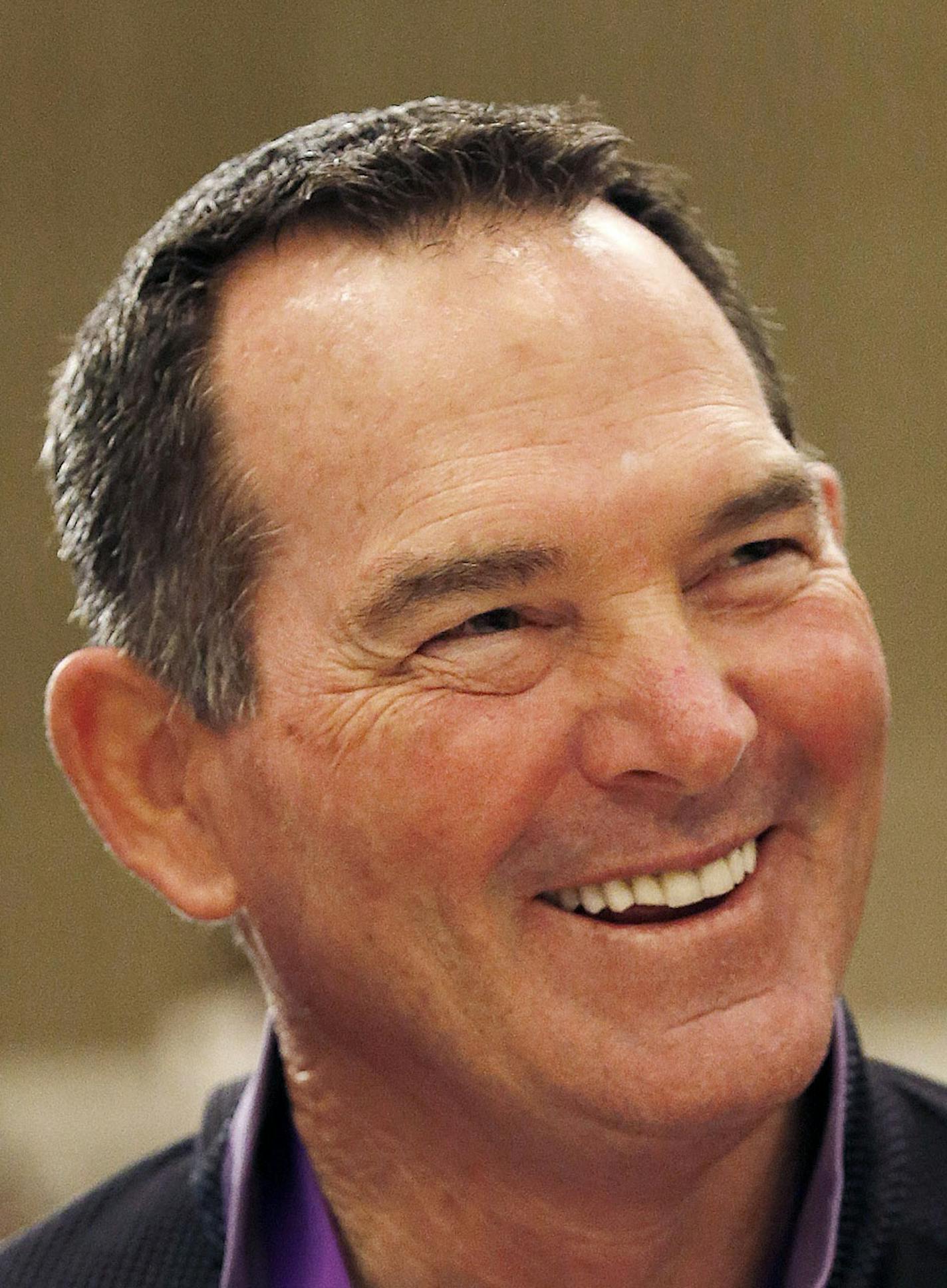 Minnesota Vikings head coach Mike Zimmer smiles as he listens to a question as NFC football coaches meet with the media during the NFL's annual meeting, Wednesday, March 25, 2015, in Phoenix. (AP Photo/Ross D. Franklin) ORG XMIT: AZRF104
