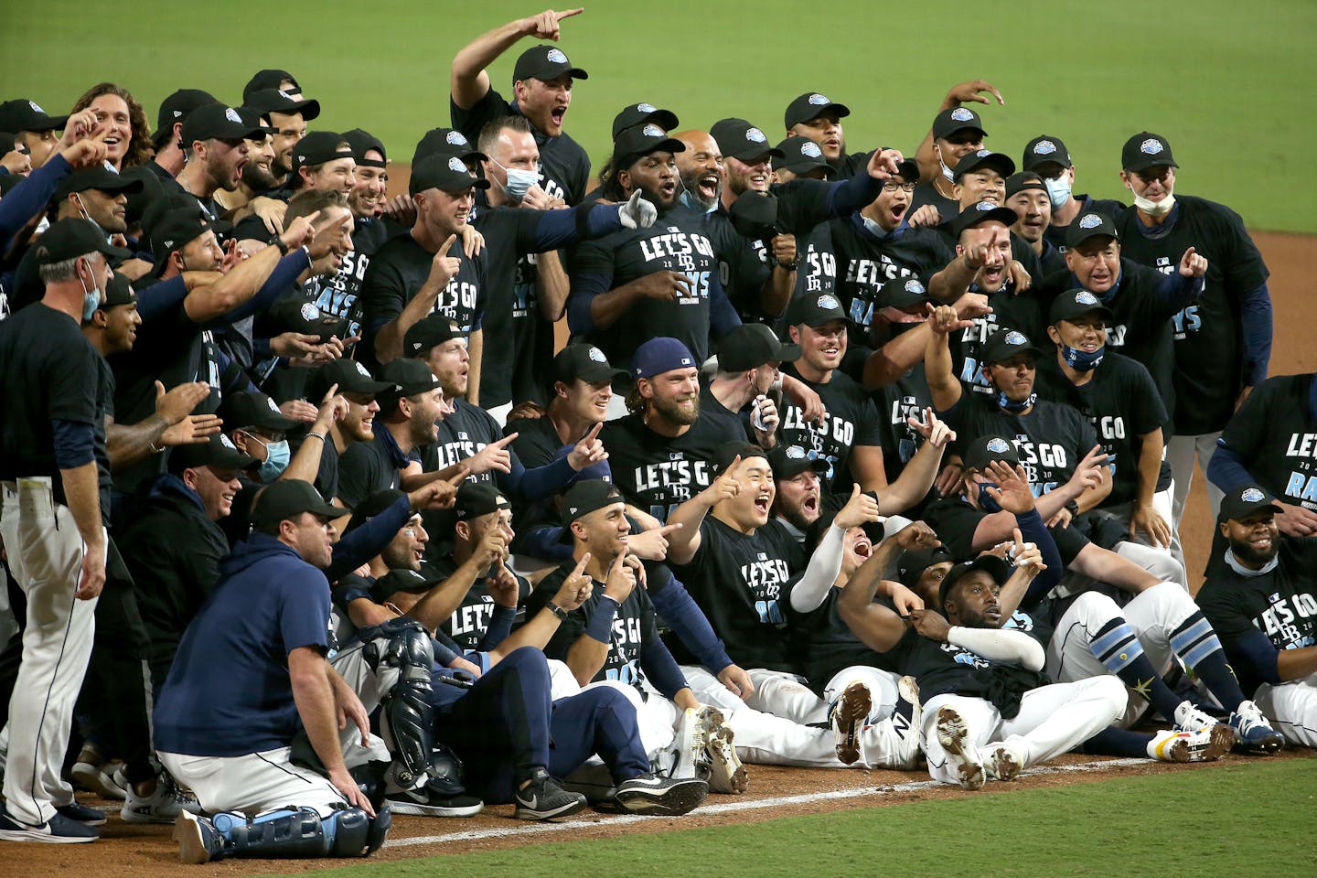 The Tampa Bay Rays celebrate a series-clinching 2-1 victory against the New York Yankees in Game 5 of the American League Division Series \