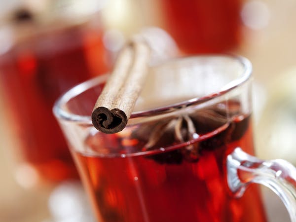 Glogg -- from istock. Close up of mulled wine glass with cinnamon stick