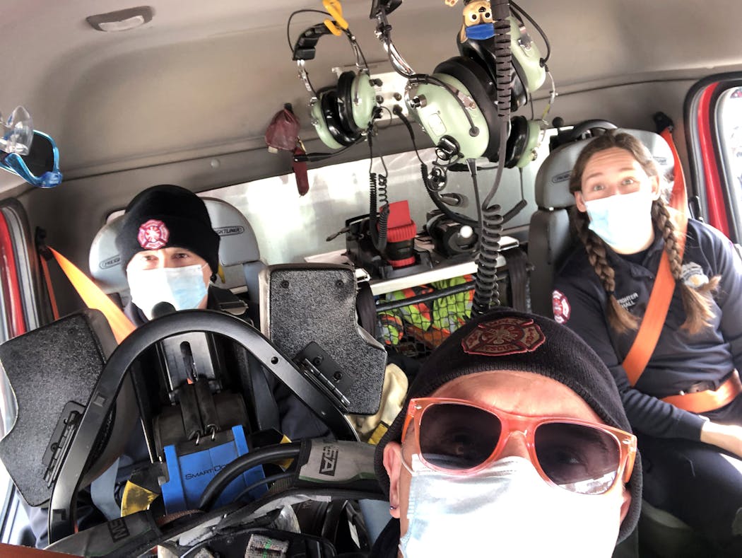 Captain Jeremy Norton along with firefighters Jenn Hall and Steve Mudek take a selfie in their rig at Station 17 in south Minneapolis. 