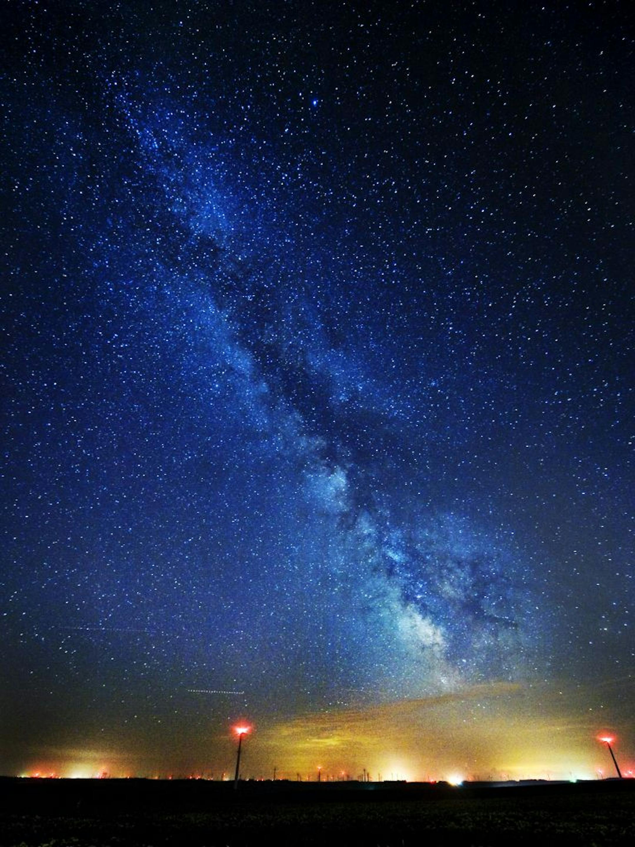 DAVID BREWSTER � dbrewster@startribune.com Saturday 08/06/10 near Hedricks, MN. The Milky Way spinned in the sky above the wind generators turning out electric power near Lake Benton and Hendricks Minnesota.