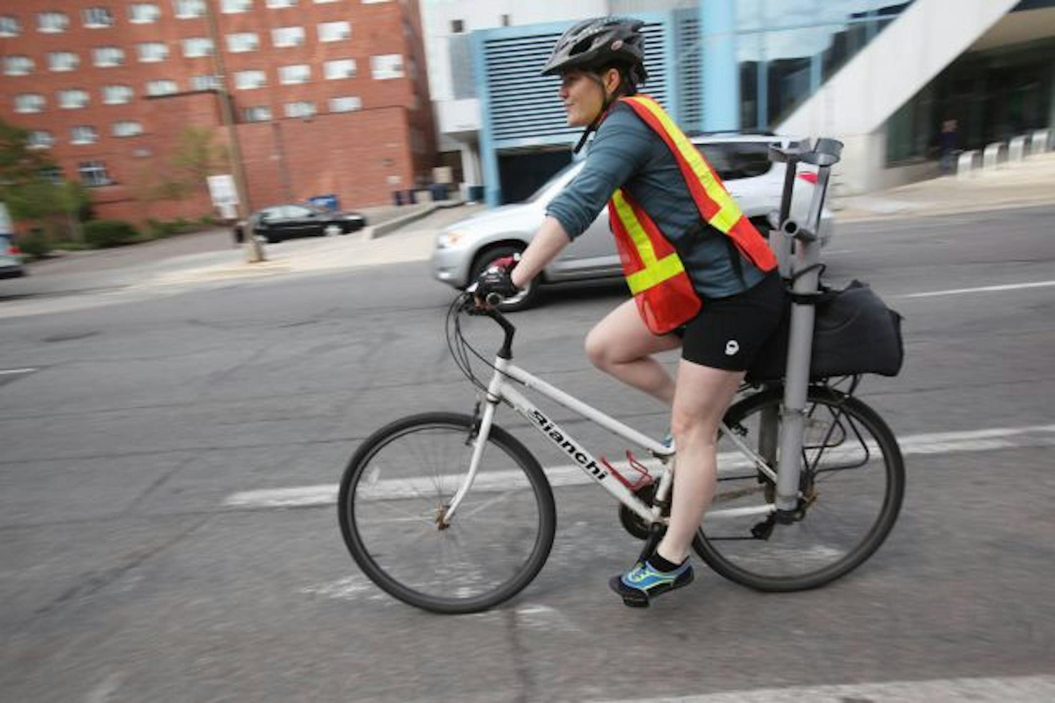 Haddayr Copley Woods, who has a MS, commuted from work downtown Minneapolis to her Powderhorn residence on a bicycle she has modified to hold her crutches.