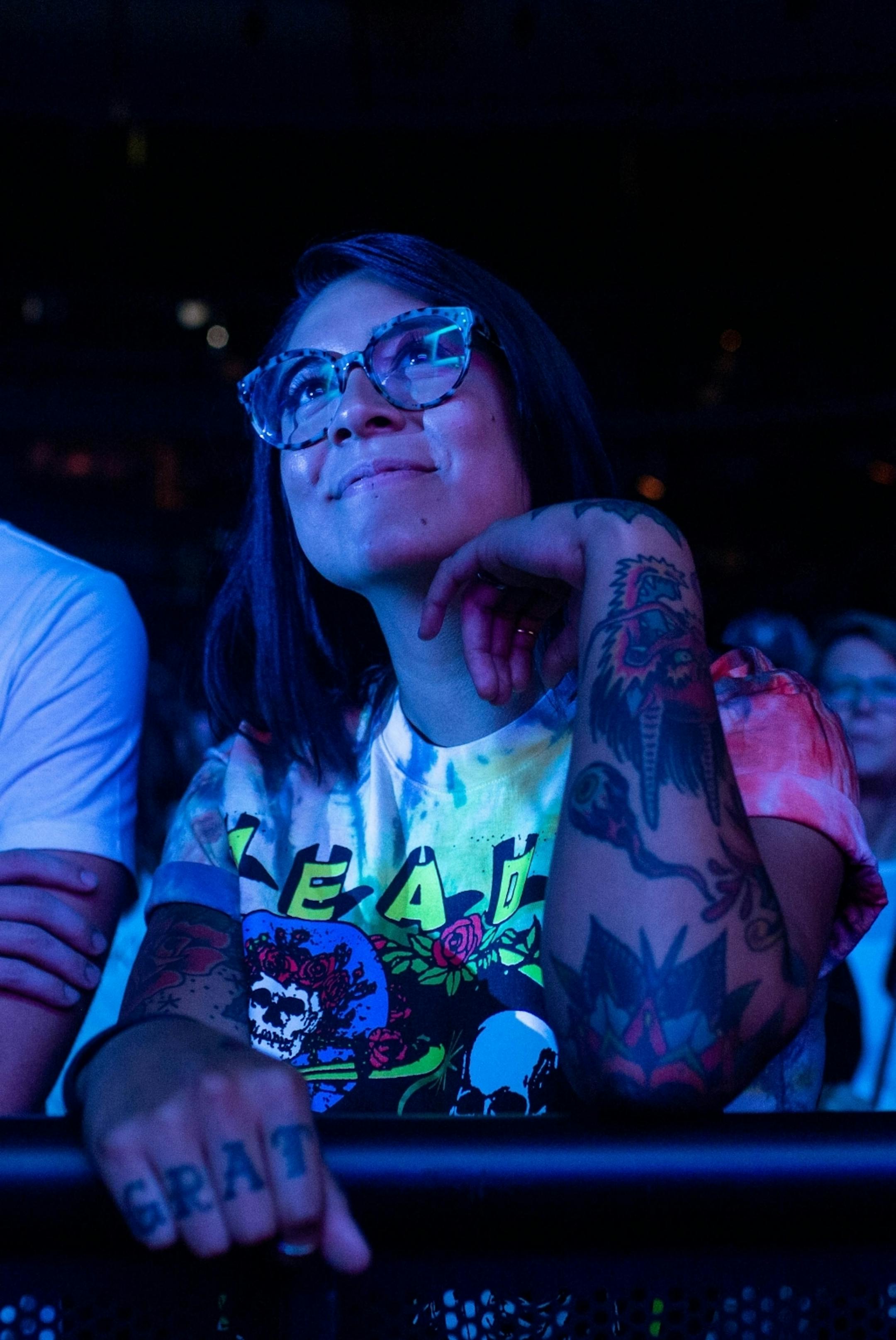 An audience member watches as John Mayer performs at Xcel Energy Center Monday, August 5, 2019.