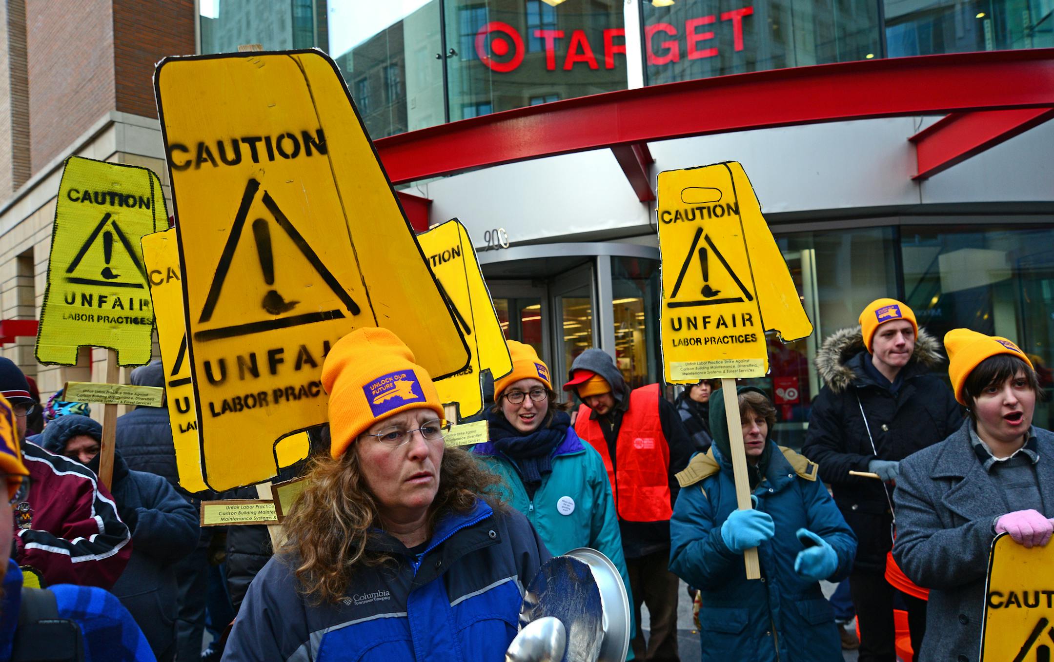 This morning Tuesday February 26, 2013 non union janitors picketed in front of the downtown Target store. About 50 people carried signs and shouted slogans while marching around the front entrance to the store. ] Richard.Sennott@startribune.com Richard Sennott/Star Tribune. , Minneapolis Minn. Tuesday 2/26/13) ** (cq)