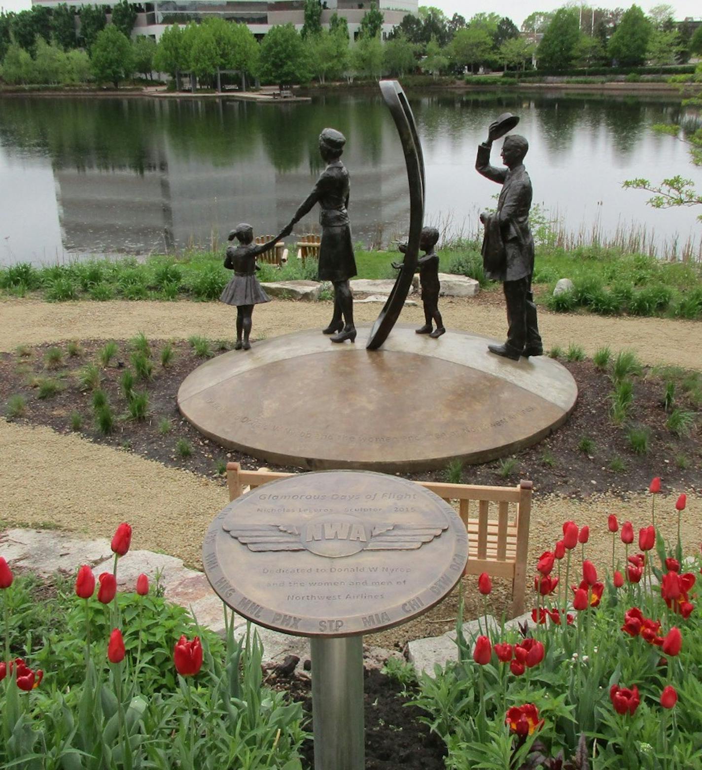 "Glamorous Days of Flight," a family boarding a Northwest flight, is one of the sculptures dedicated to the men and women of the former Northwest Airlines at Centennial Lakes Park in Edina.