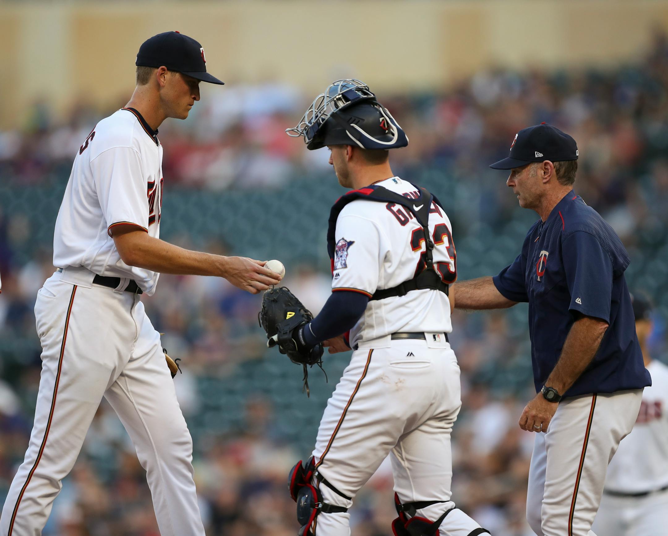 Aaron Slegers handed the ball to manager Paul Molitor after being pulled in the second inning Tuesday at Target Field.