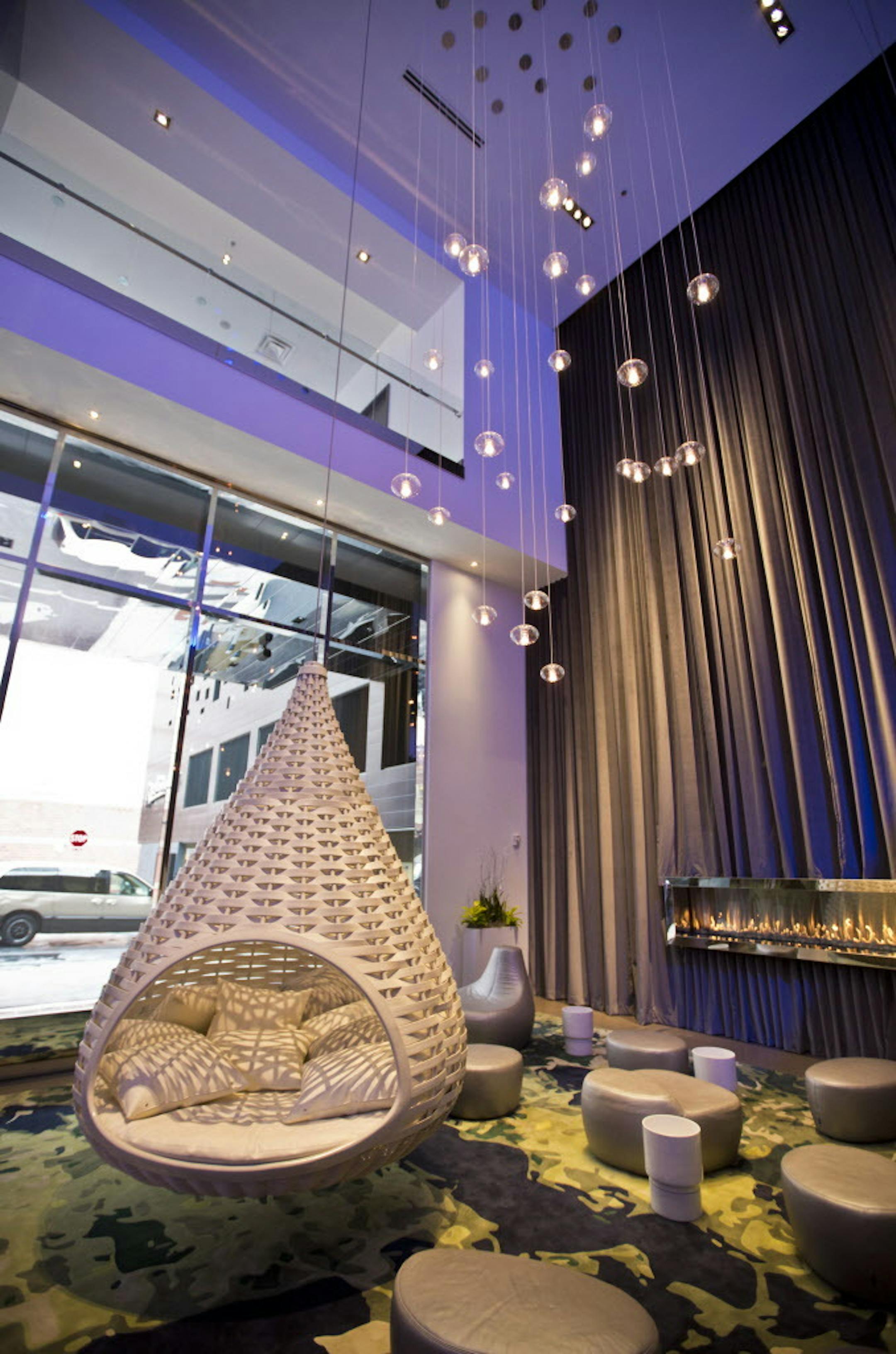 A lounge in the lobby has swings and a topographic map rug of the area at the new Radisson Blu at the Mall of America on Friday, March 15, 2013, in Bloomington, Minn. The Radisson Blu cost $137 million, has 500 rooms and is connected to the Mall of America through a skyway. ] (RENEE JONES SCHNEIDER * reneejones@startribune.com)