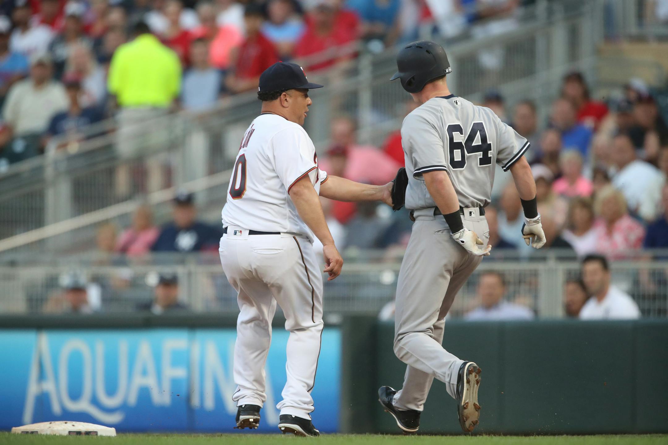 Bartolo Colon tagged out New York Yankees first baseman Garrett Cooper (64) in the third inning Tuesday.