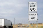 A semi-truck passes by a newly posted 80 mph speed limit sign on Interstate 90 near Brandon, S.D., Wednesday, April 1, 2015, Department of Transportat