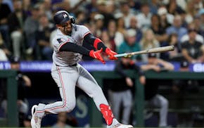 Minnesota Twins' Royce Lewis strikes out swinging during the ninth inning Friday.