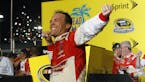 Kevin Harvick celebrates winning the NASCAR Sprint Cup championship series auto race, Sunday, Nov. 16, 2014 in Homestead, Fla. (AP Photo/Terry Renna)
