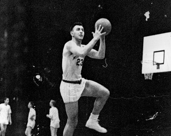 Ed Kalafat started at center for the Gophers from 1951-1954.