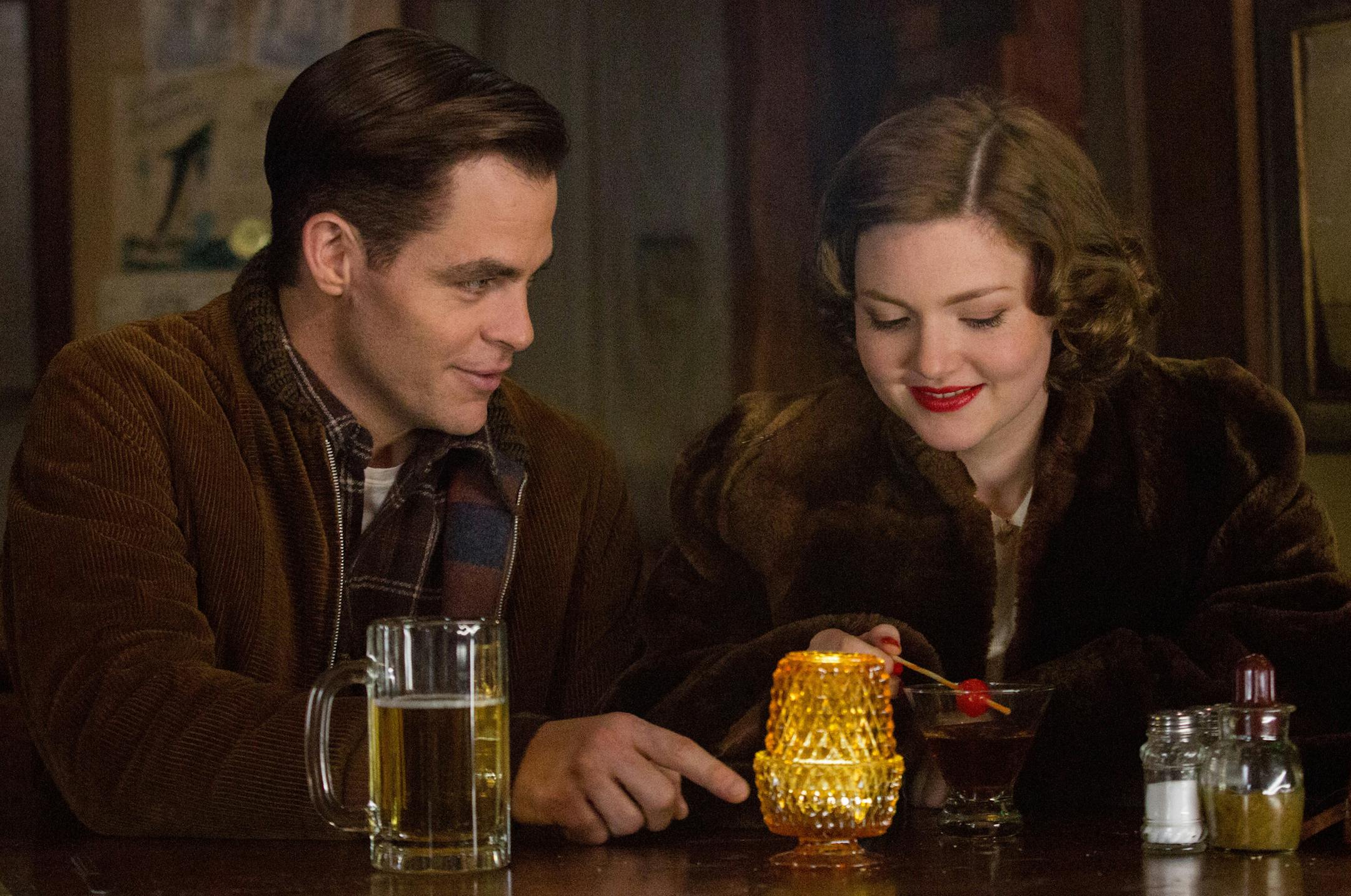 In this image released by Disney, Chris PIne, left, and Holliday Grainger appear in a scene from, "The Finest Hours," a heroic action-thriller based on the true story of the most daring rescue in the history of the Coast Guard. (Claire Folger/Disney via AP)