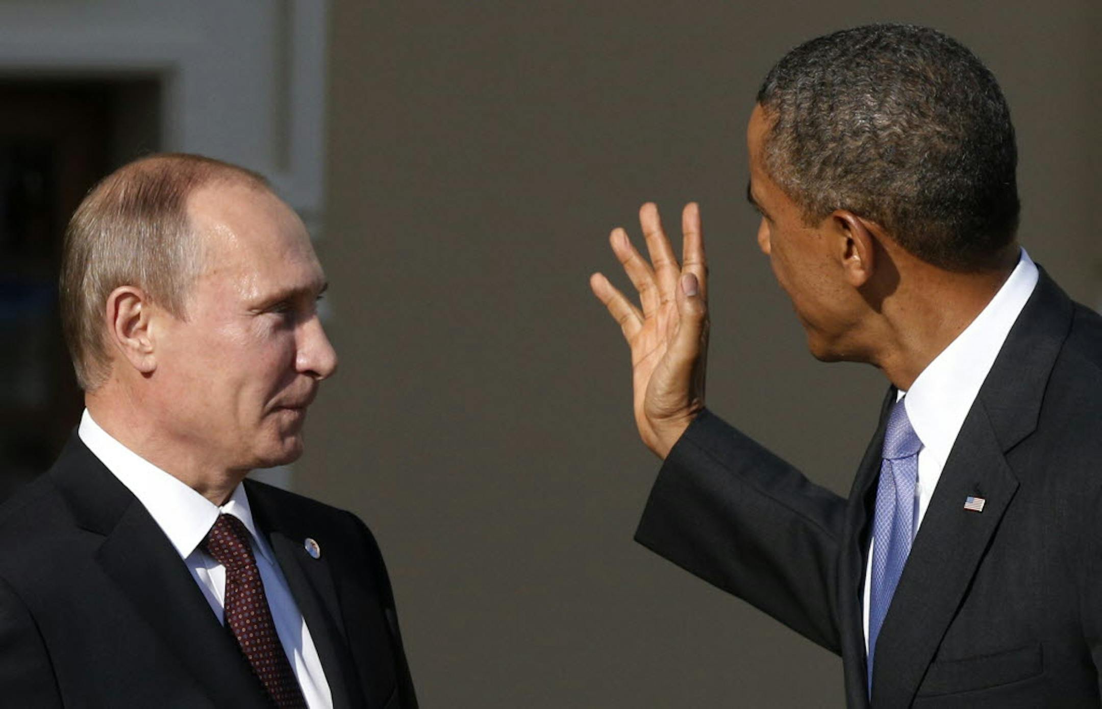 President Barack Obama gestures as he speaks to Russia's President Vladimir Putin at the G-20 summit at the Konstantin Palace in St. Petersburg, Russia on Sept. 5.