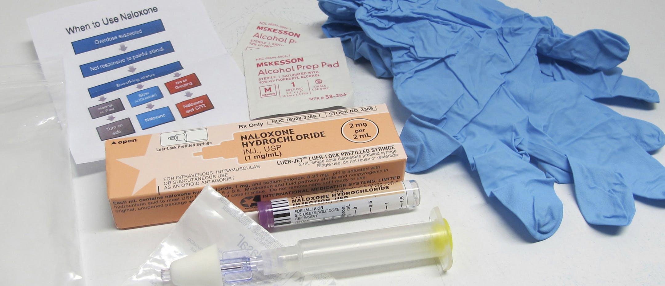 FILE - This May 13, 2015, file photo shows the contents of a drug overdose rescue kit at a training session on how to administer naloxone, which reverses the effects of heroin and prescription painkillers, in Buffalo, N.Y. In addition to checking out and re-shelving books, San Francisco public library staffers may soon be trained to administer medication to reverse heroin overdoses among the growing number of opioid users who are homeless. (AP Photo/Carolyn Thompson, File) ORG XMIT: MIN201704201