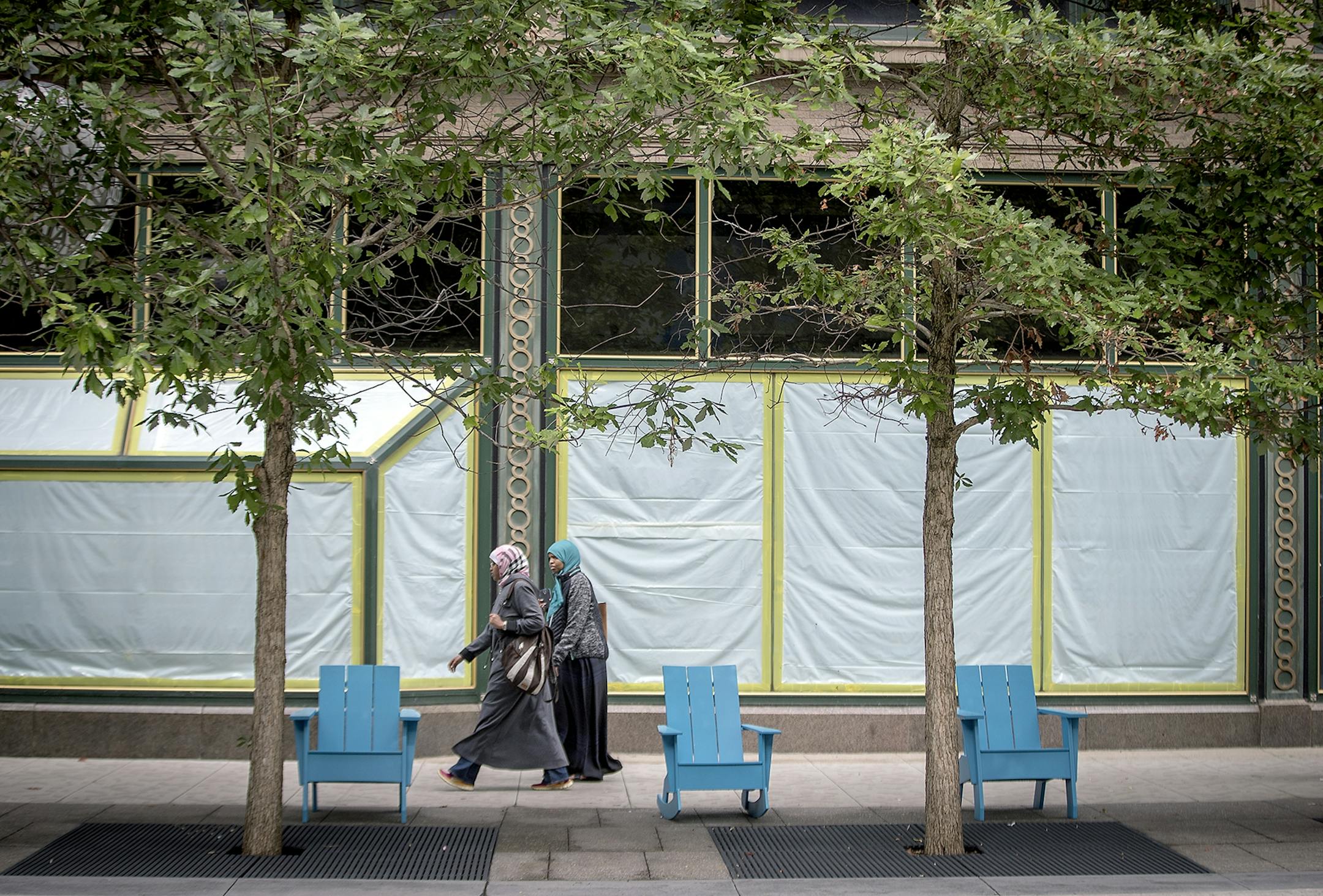 Pedestrians made their way along Nicollet Mall where the trees on the newly redesigned area are dying en masse, Wednesday, June 6, 2018 in Minneapolis, MN. The city may have to replant them because they're dying so quickly.