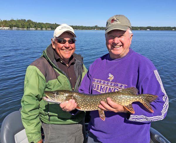 Longtime Brainerd-Nisswa area fishing guide Marv Koep, left, with Fr. Mike Arms, a regular walleye-angliing partner and retired Catholic priest who mo