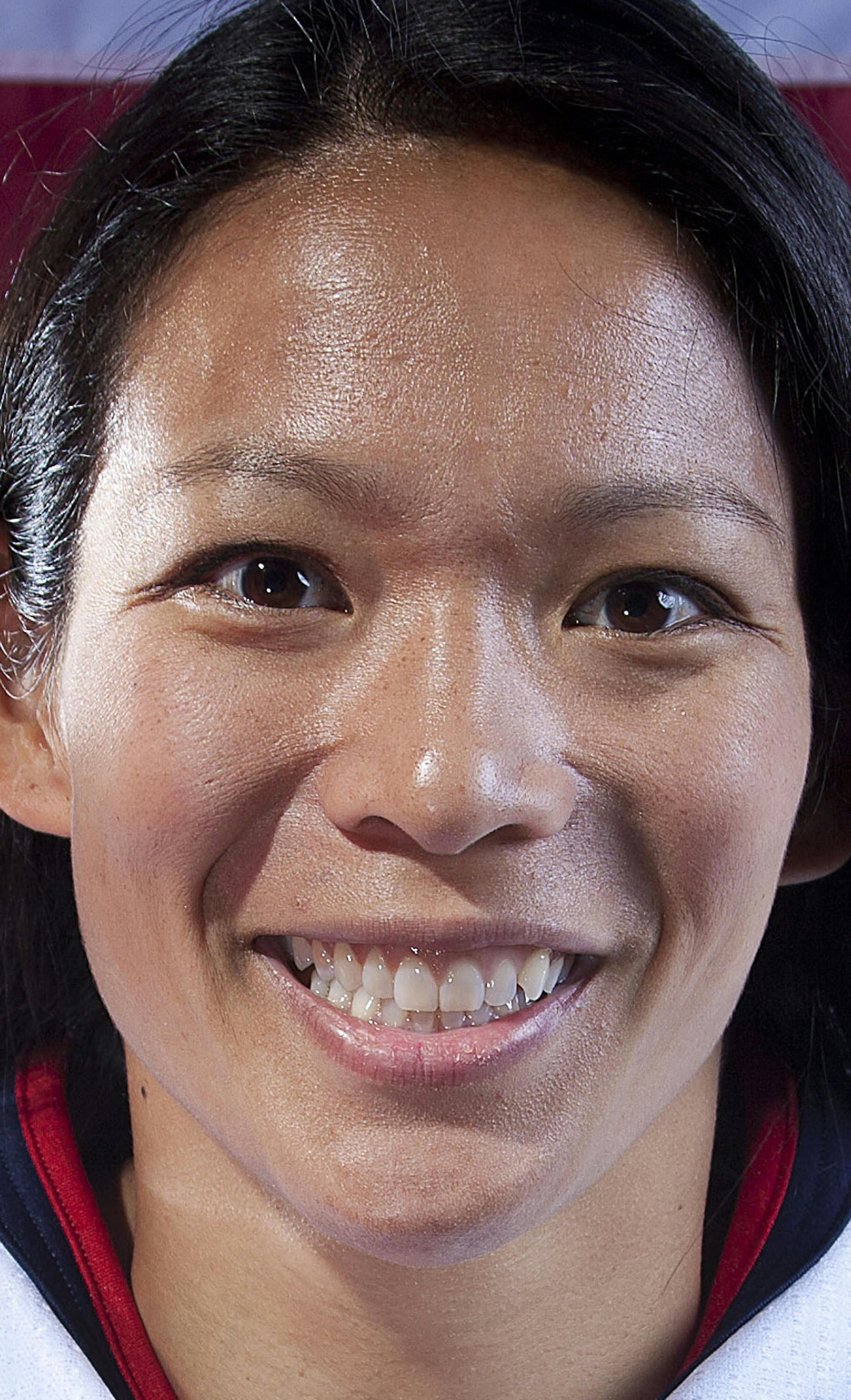 FILE - In this Oct. 2, 2013, file photo, United States women's hockey player Julie Chu poses for a portrait at the 2013 Team USA Media Summit in Park City, Utah. At 31, she's the oldest member of the U.S. team, and she'll be heading to her fourth Olympics in search of her first gold, after already collecting two silvers and a bronze. (AP Photo/Carlo Allegri, File) ORG XMIT: NY181