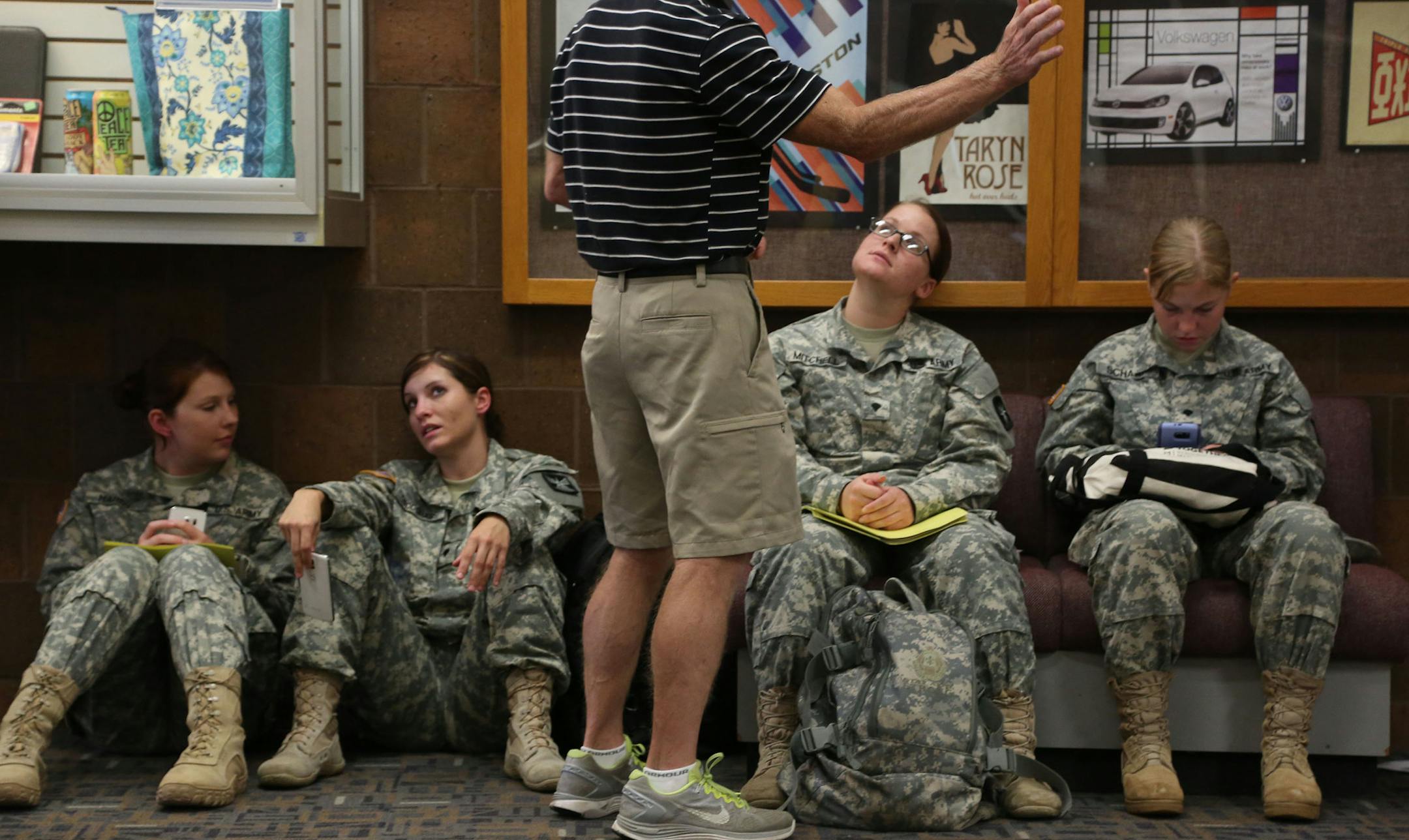 Specialist Amber Mitchell talked with her father Raymond as the waited for the Welcoming home ceremony to start. ] (KYNDELL HARKNESS/STAR TRIBUNE) kyndell.harkness@startribune.com Forty-two soldiers from the Minnesota National Guard's 204th Area Support Medical Company had a welcome home ceremony at Century College in White Bear Lake , Min., Saturday August 29, 2015. ORG XMIT: MIN1508291701190198