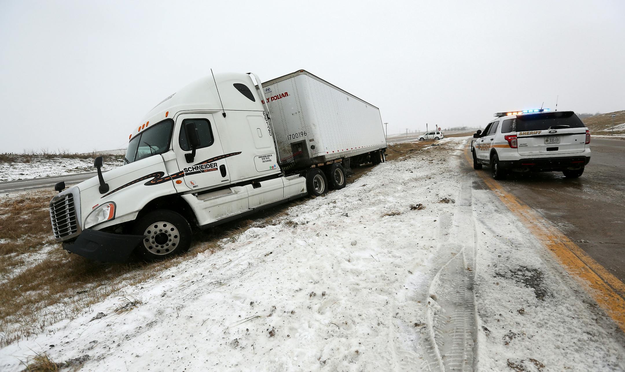 A semi-tractor trailer slid off U.S. 61 north of Zwingle, Iowa, on Monday, Dec. 28, 2015. The storm system that spawned weekend twisters in North Texas brought winter storm woes to the Midwest on Monday.