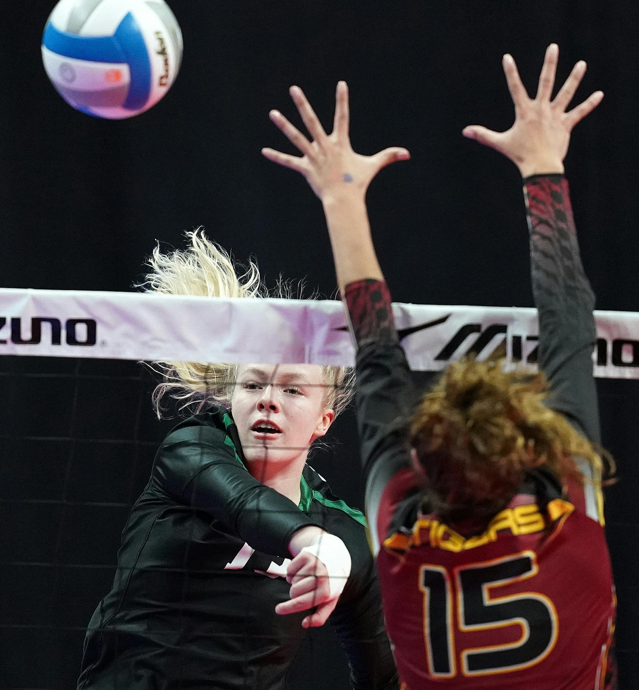 Concordia outside hitter Kira Fallert (13) hit the ball past Stewartville outside hitter Kaitylyn Prondzinski (15) in the first set. ] ANTHONY SOUFFLE • anthony.souffle@startribune.com Stewartville played Concordia in a Class AA semifinal volleyball game Friday, Nov. 8, 2019 at the Xcel Energy Center in St. Paul, Minn2