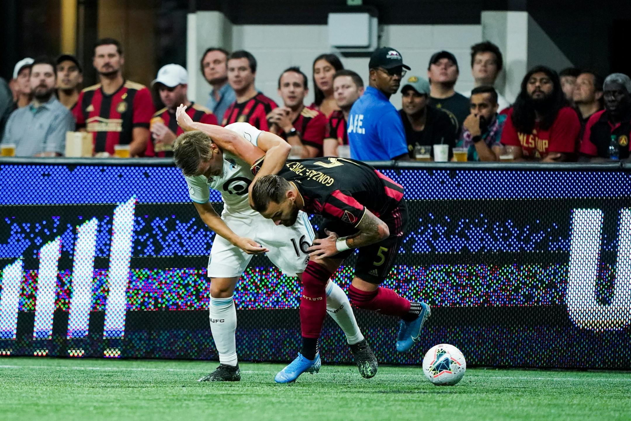 Minnesota United midfielder Robin Lod (16) and Atlanta United defender Leandro Gonzalez (5) battle for the ball during the U.S. Open Cup at Mercedes-Benz Stadium in Atlanta on Tuesday, Aug. 27, 2019. Photo by Kevin D. Liles for the Star Tribune