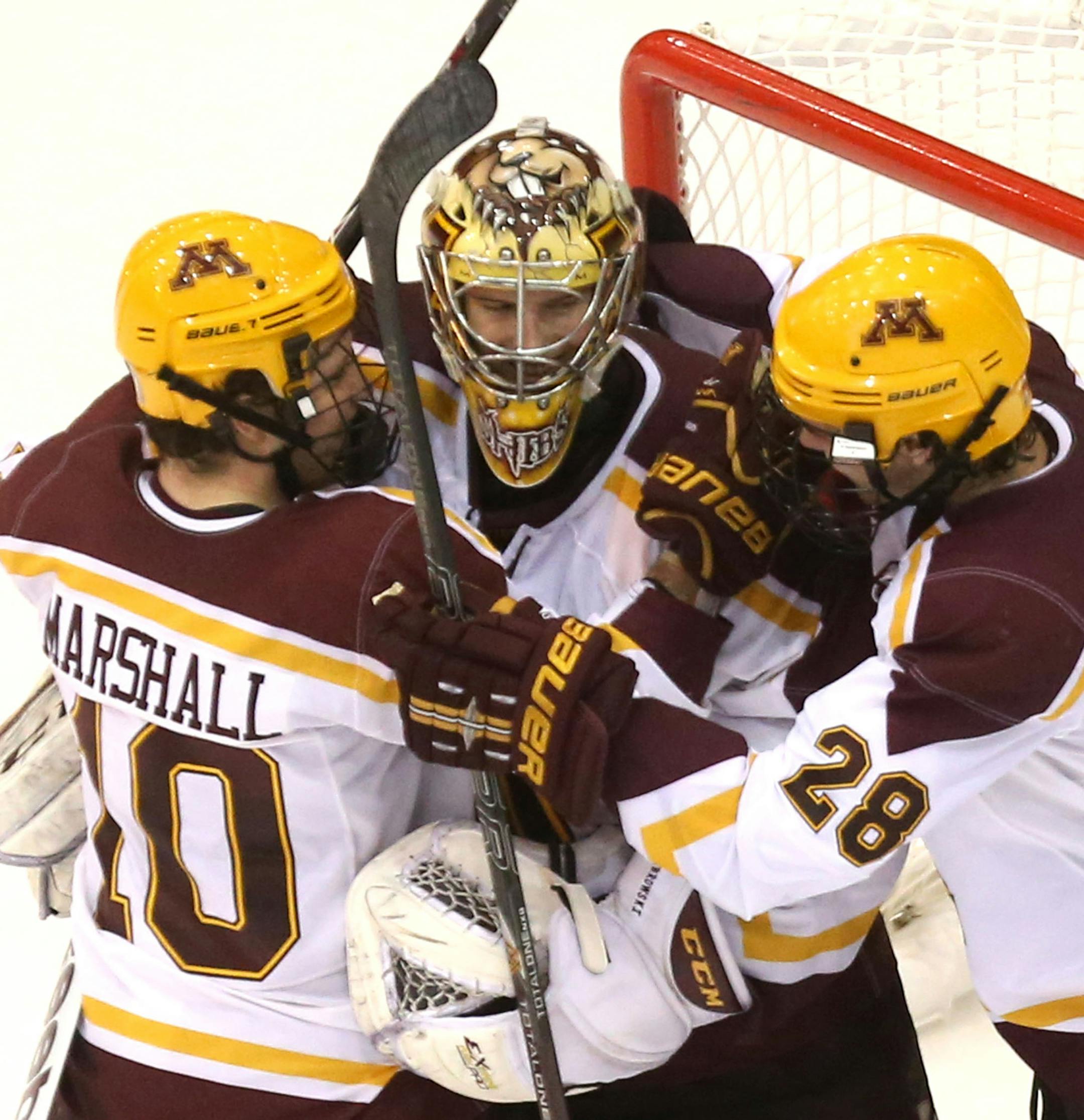 Gophers goalie Michael Shibrowski got congratulated by his teammates Ben Marshall and Jake Bischoff after shutting out Minnesota State at Mariucci Arena in Minneapolis, Min., Saturday, November 16, 2013.Gophers won over the Minnesota State Mavericks 3-0. ] (KYNDELL HARKNESS/STAR TRIBUNE) kyndell.harkness@startribune.com