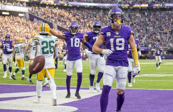 Minnesota Vikings wide receiver Adam Thielen (19) celebrates his touchdown during the second quarter of an NFL football game against the Green Bay Pac