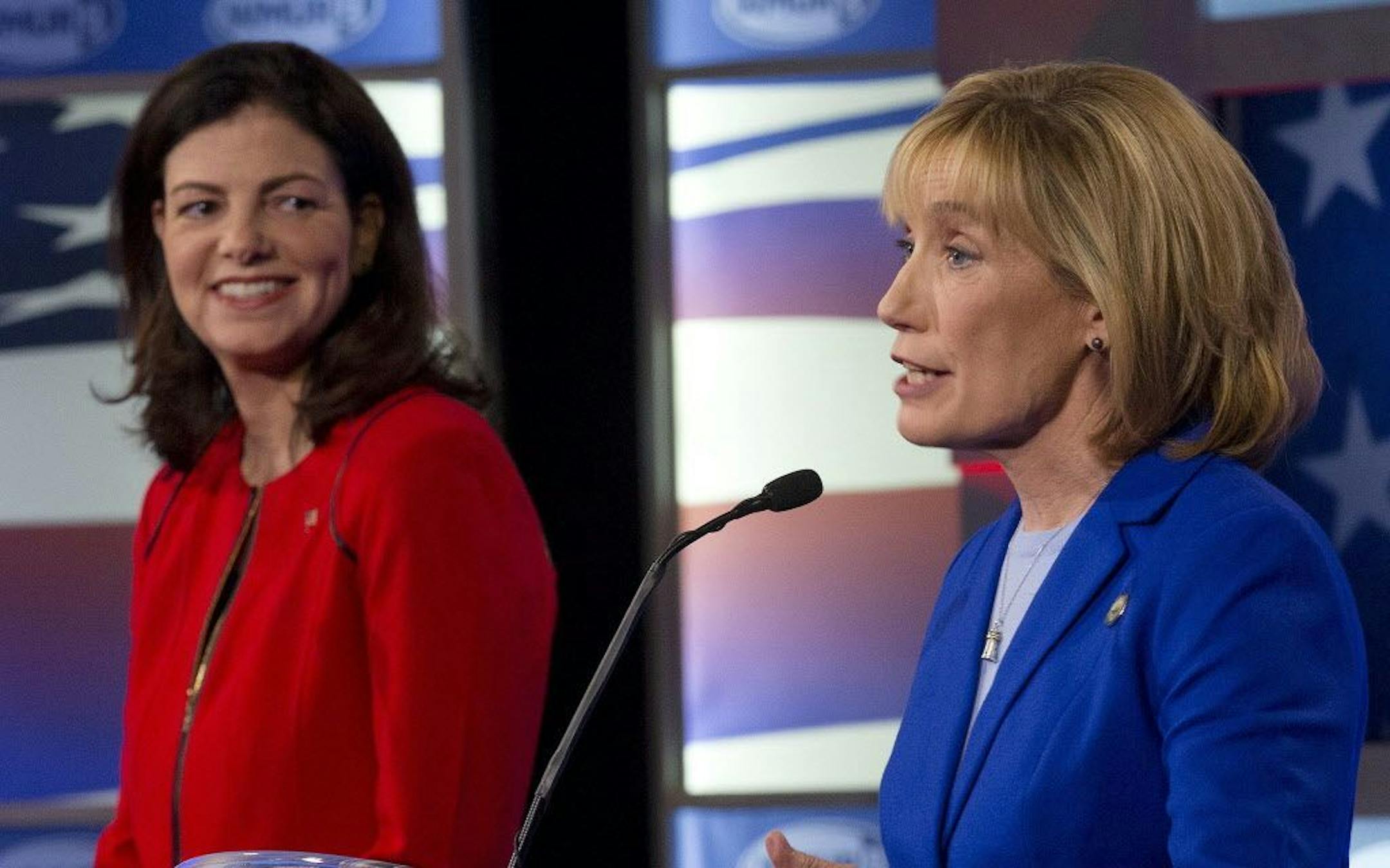 U.S. Senate Republican incumbent Kelly Ayotte, left, listens to Democratic challenger Gov. Maggie Hassan during a live televised debate Wednesday, Nov. 2, 2016, in Manchester, N.H.