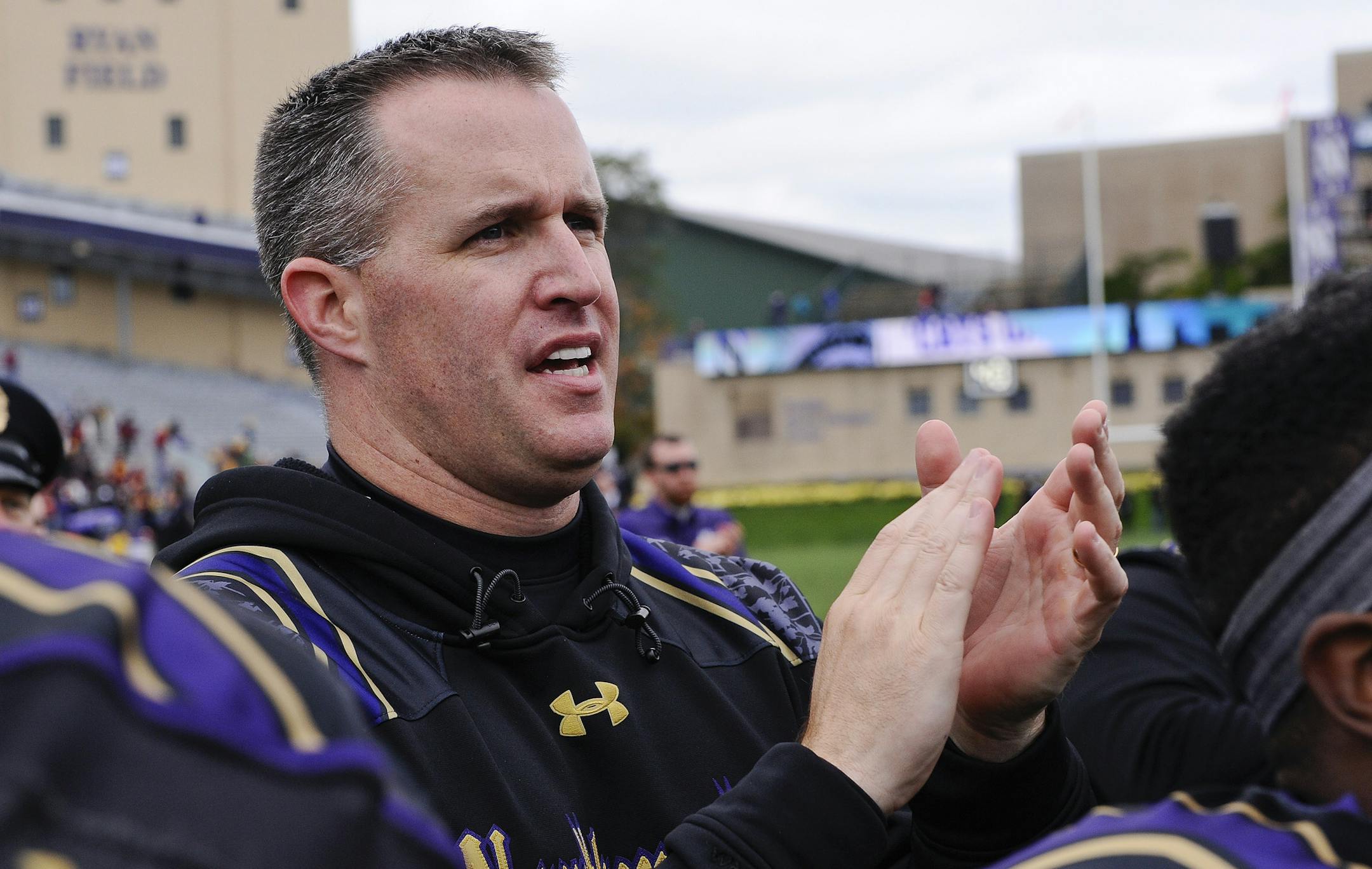 Northwestern head coach Pat Fitzgerald sings the school song with players after an NCAA college football game against Minnesota in Evanston, Ill., Saturday, Oct. 3, 2015. (AP Photo/Matt Marton) ORG XMIT: MIN2015111217220657