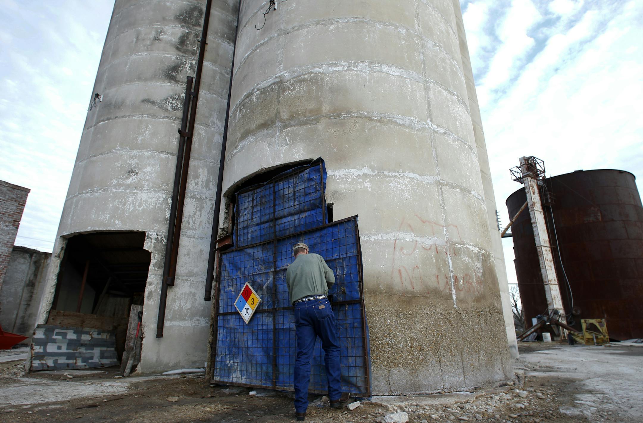 Robert Payne, operator of RPA Associates, secured a door latch on a grain silo where he stores ammonium nitrate. He is more aware of safety now.