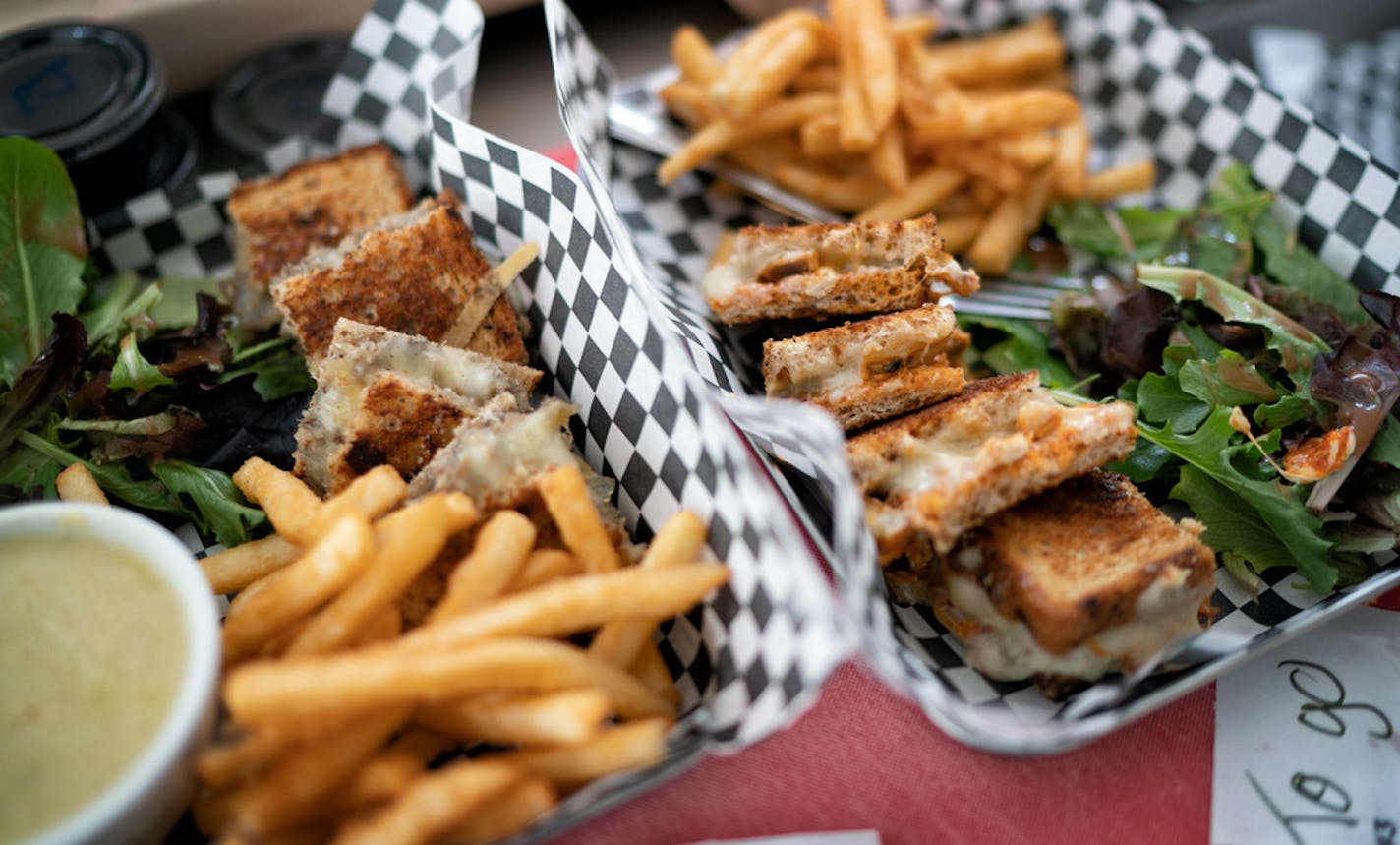 All Square grilled cheese shop meals ready to be served to customers. ] GLEN STUBBE • glen.stubbe@startribune.com Friday, February 22, 2019 Founded by a civil rights attorney, All Square grilled cheese shop employs formerly incarcerated people -- who often find it difficult to land a job -- giving them a chance to move forward after they've paid their debts to society. We come for the lunch rush (starts at 12) to see All Square and its employees in action. Around 1:30 when things quiet down, I'l