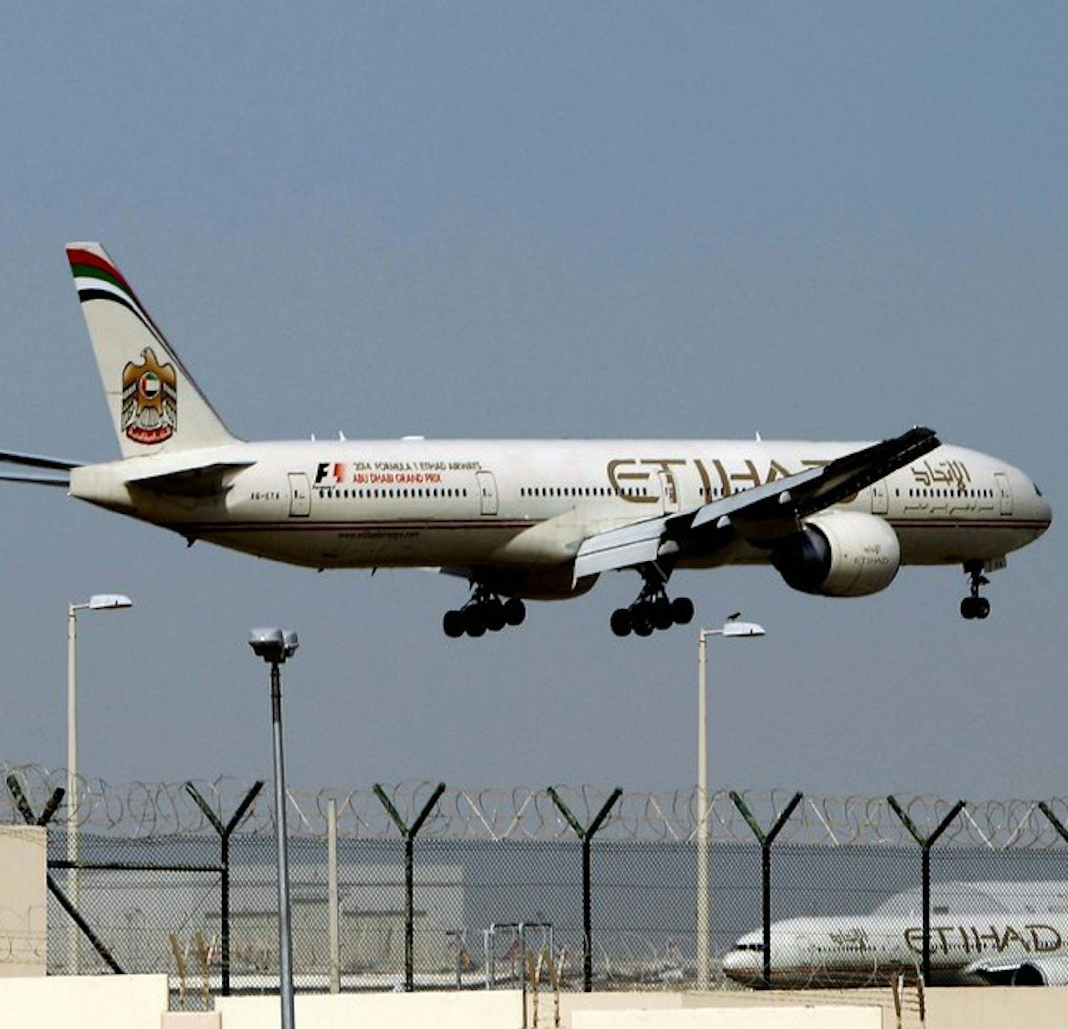 FILE - In this May 4, 2014 file photo, an Etihad Airways plane prepares to land at the Abu Dhabi airport in the United Arab Emirates. The United Arab Emirates' national carrier has formally submitted a document to the United States government rebutting allegations by U.S. carriers that it receives unfair subsidies. (AP Photo/Kamran Jebreili, File) ORG XMIT: ARE101