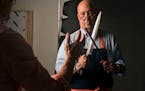 Photographer Steve Henke helped arrange a custom made Japanese knife in Andrew Zimmern's hands for a photoshoot for Midwest Living at his studio in Go