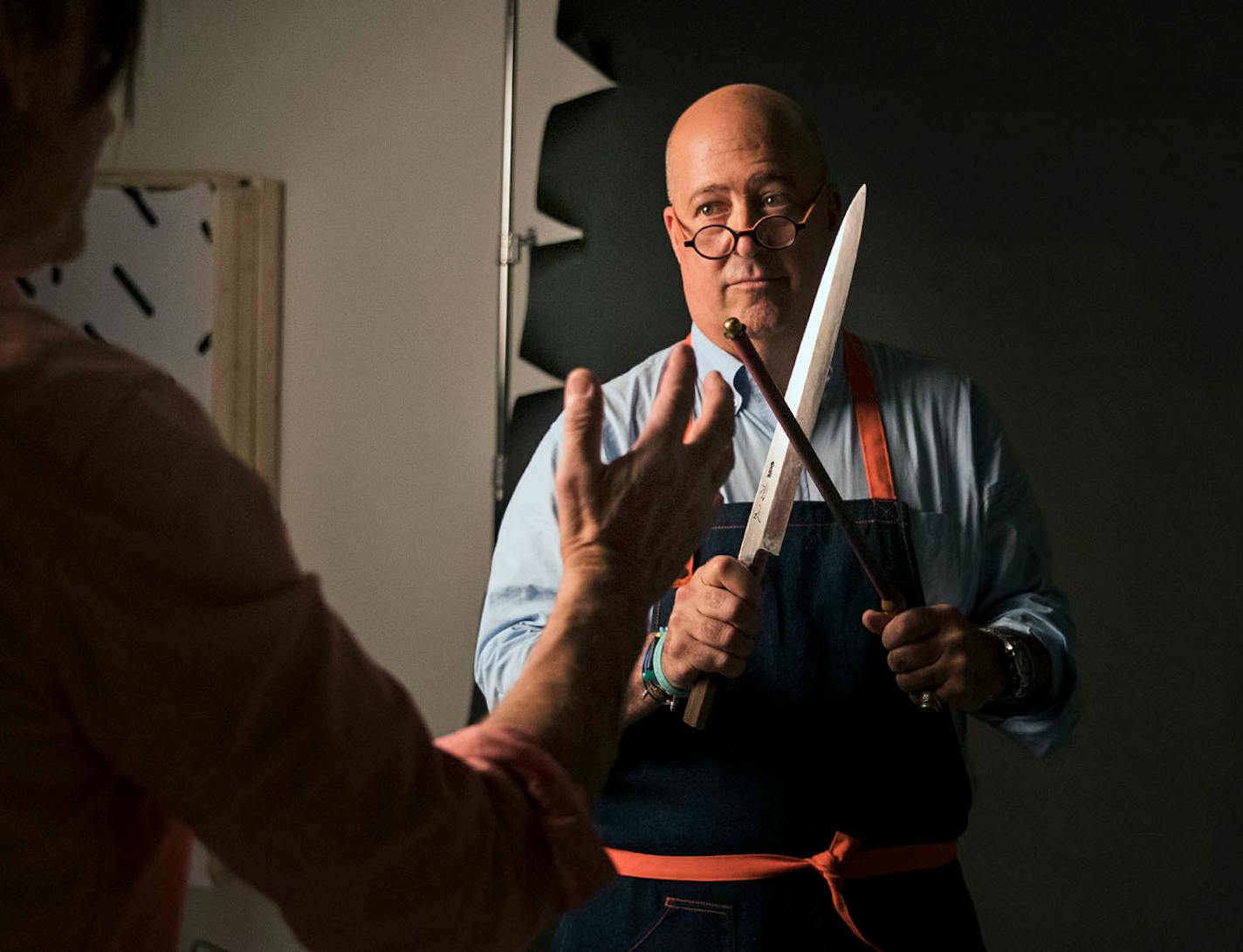 Photographer Steve Henke helped arrange a custom made Japanese knife in Andrew Zimmern's hands for a photoshoot for Midwest Living at his studio in Golden Valley, Minn., on Friday, May 26, 2017.