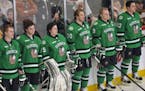 The University of North Dakota lined up before a hockey game in 2012, the year when the school dropped its "Fighting Sioux" nickname and logo.