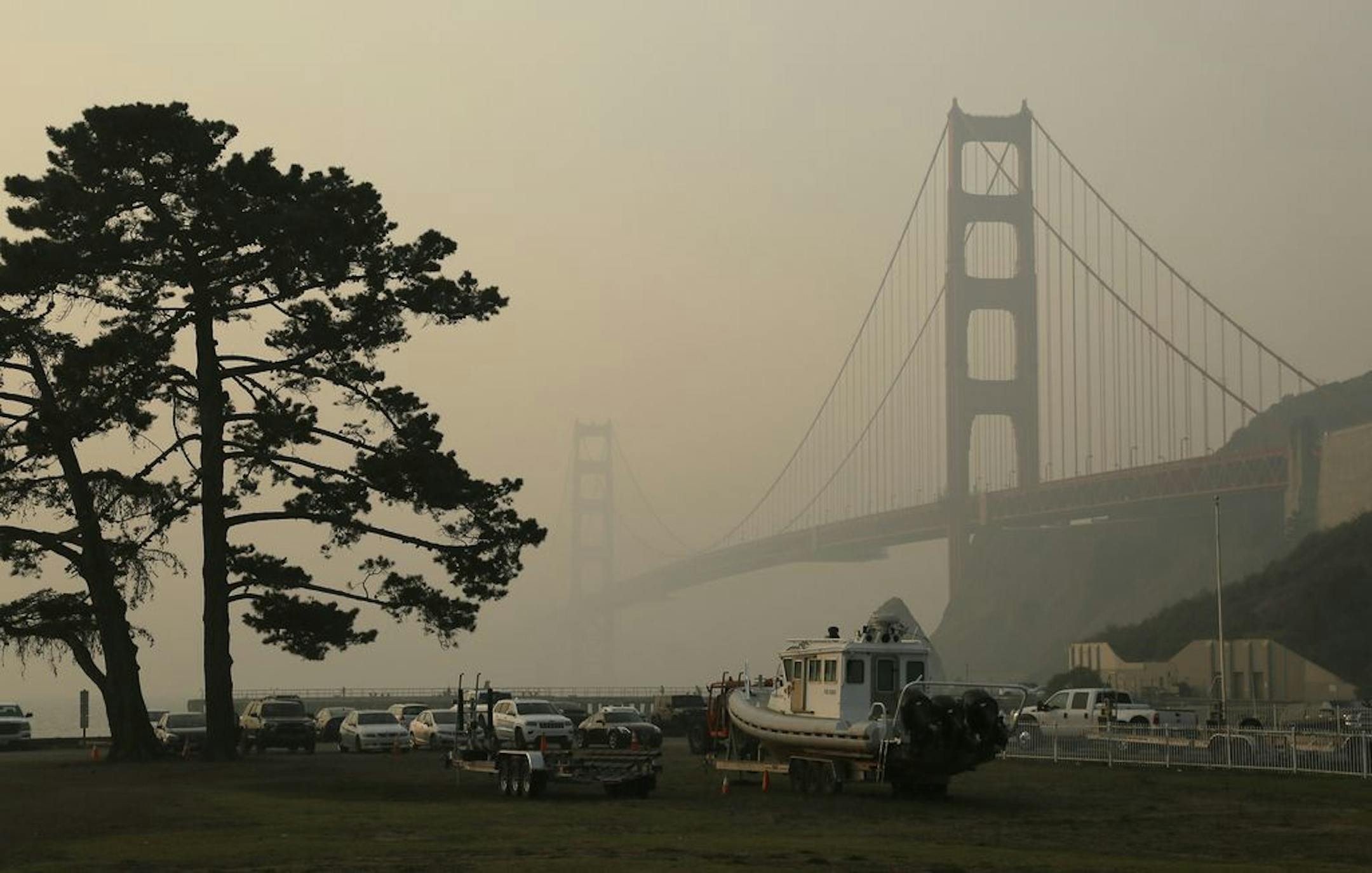 FILE - In this Nov. 16, 2018, file photo, the Golden Gate Bridge is obscured by smoke and haze from wildfires in this view from Fort Baker near Sausalito, Calif. Tens of millions of people in the Western US face a growing health risk due to wildfires as more intense and frequent blazes churn out greater volumes of lung-damaging smoke, according to research scientists at NASA and several major universities.