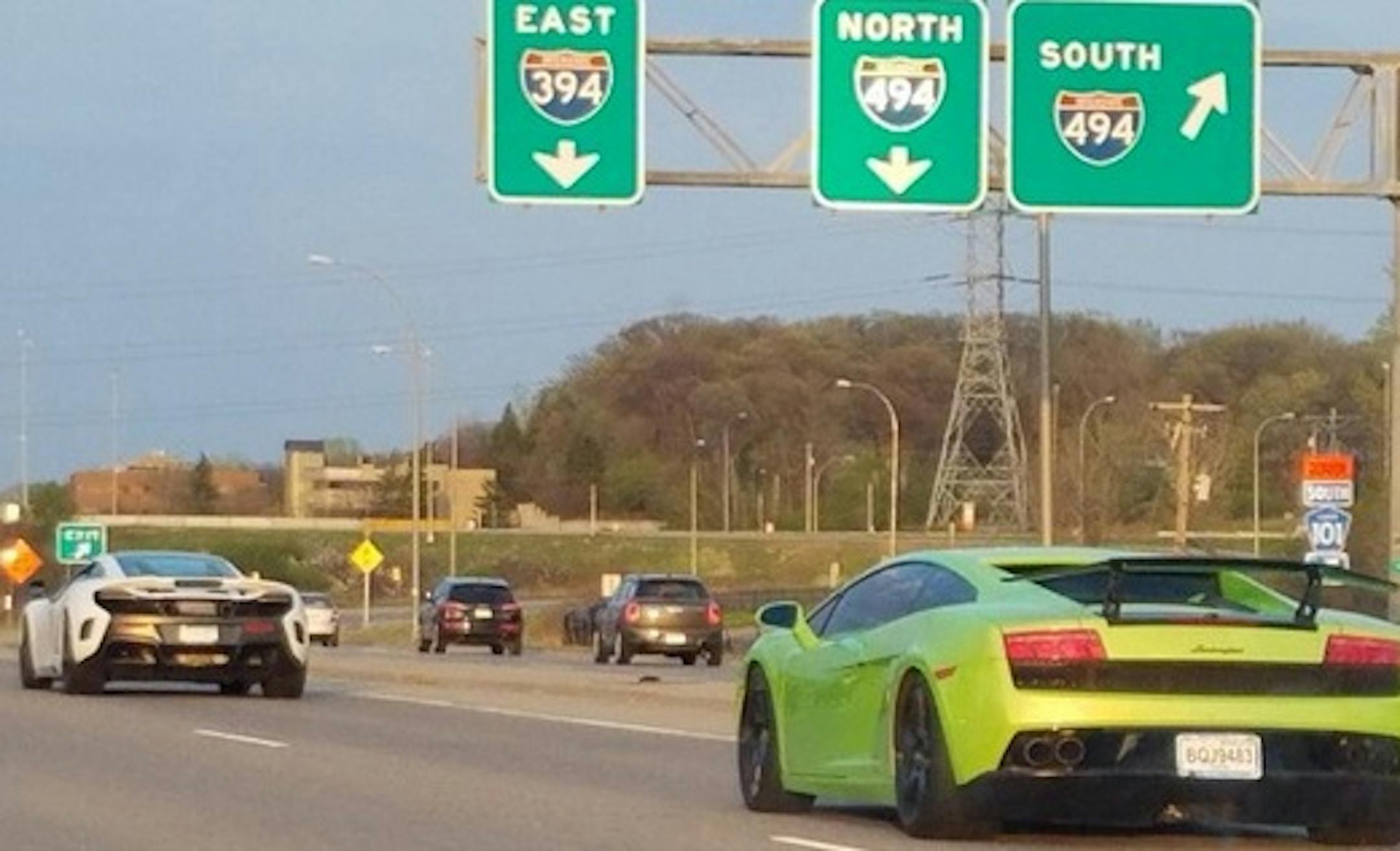 This photo taken April 23 by a motorist showed some of the high-end sports cars during their questionable cruise along Interstate 394.