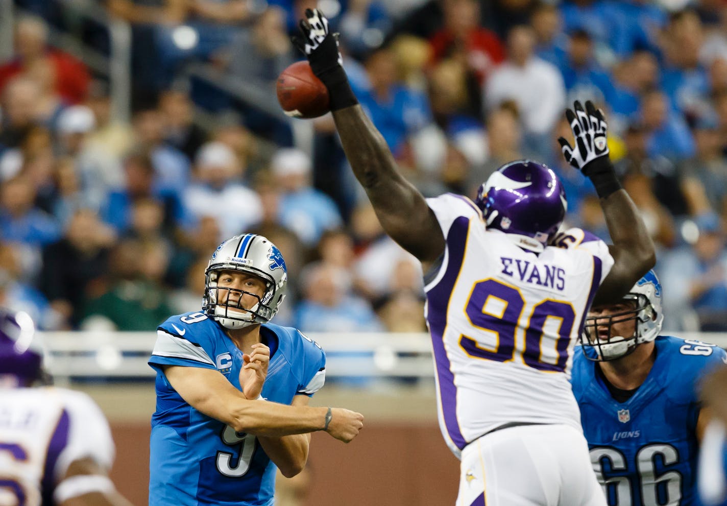 Minnesota Vikings nose tackle Fred Evans (90) blocks a pass by Detroit Lions quarterback Matthew Stafford (9) during the second half at Ford Field in Detroit, Sunday, Sept. 30, 2012. (AP Photo/Rick Osentoski)