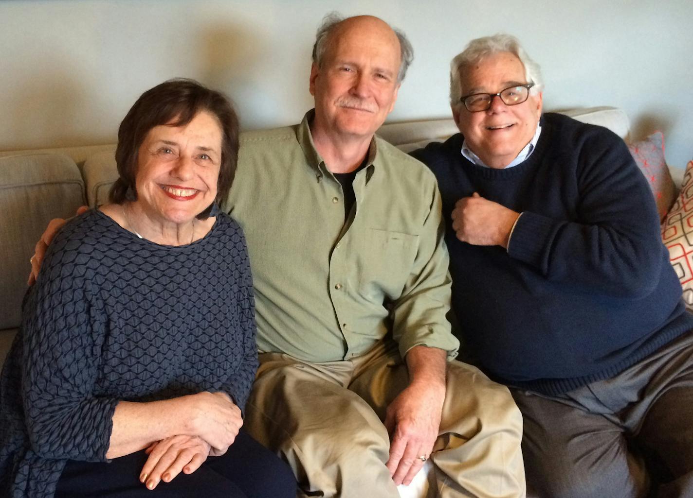 Artist Claude Riedel, center, with Ruth and Walter Elias. The Eliases asked Riedel to make a ner tamid with barbed wire from the labor camp in Poland where many in their family toiled.