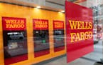 FILE - This Jan. 13, 2021 file photo shows a Wells Fargo office in New York. Wells Fargo &amp; Co. says first-quarter net income jumped to $4.74 billi