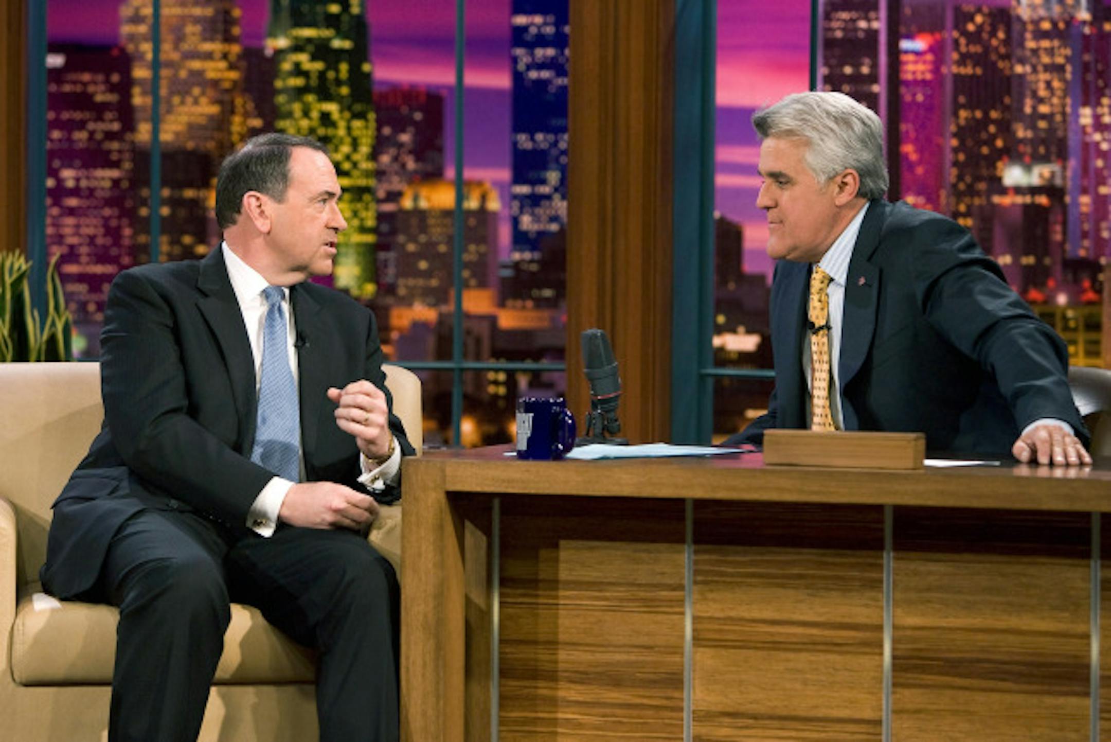 BURBANK, CA - JANUARY 2: (NO SALES; NO ARCHIVE; EDITORIAL USE ONLY) In the handout image provided by NBC Universal, Inc., talk show host Jay Leno (L) speaks to Republican presidential hopeful and former Arkansas governor Mike Huckabee during a taping of The Tonight Show With Jay Leno at NBC Studios January 2, 2008 in Burbank, California. This will be the first airing of the show since the Writers Guild of America went on strike November 5.