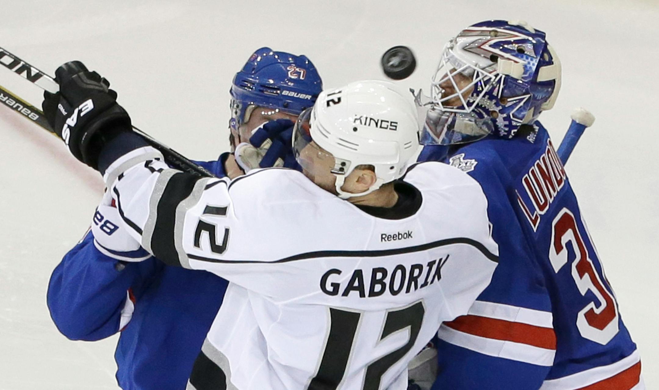The Kings' Marian Gaborki battled Rangers defenseman Ryan McDonagh and goalie Henrik Lundqvist as the puck bounced up during Game 3 on Monday.