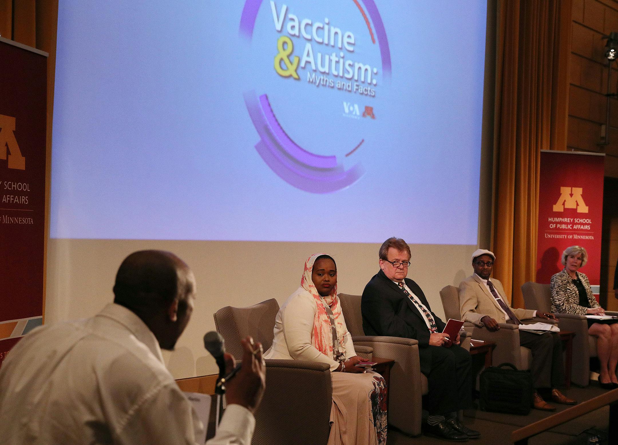 Abdirisak Jama, who has a child who he says didn't have autism until he was vaccinated, told his story and raised concerns to a panel of experts, including from left, Deeqa-Ifrah Hussein, Dr. Mark Schleiss, Dr. Mohamud Dahir Afgarshe, and Kristen Ehresmann, moderated by Vincent Makori, as they discussed vaccines and autism Saturday at the Cowles Auditorium in the Humphrey School of Public Affairs at the University of Minneapolis. ] ANTHONY SOUFFLE &#xef; anthony.souffle@startribune.com Vaccinati
