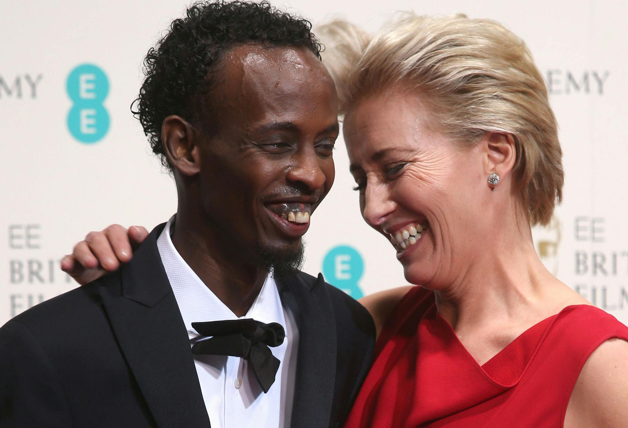 Barkhad Abdi, winner of best supporting actor, and Emma Thompson pose for photographers in the winners room at the EE British Academy Film Awards on Sunday in London.
