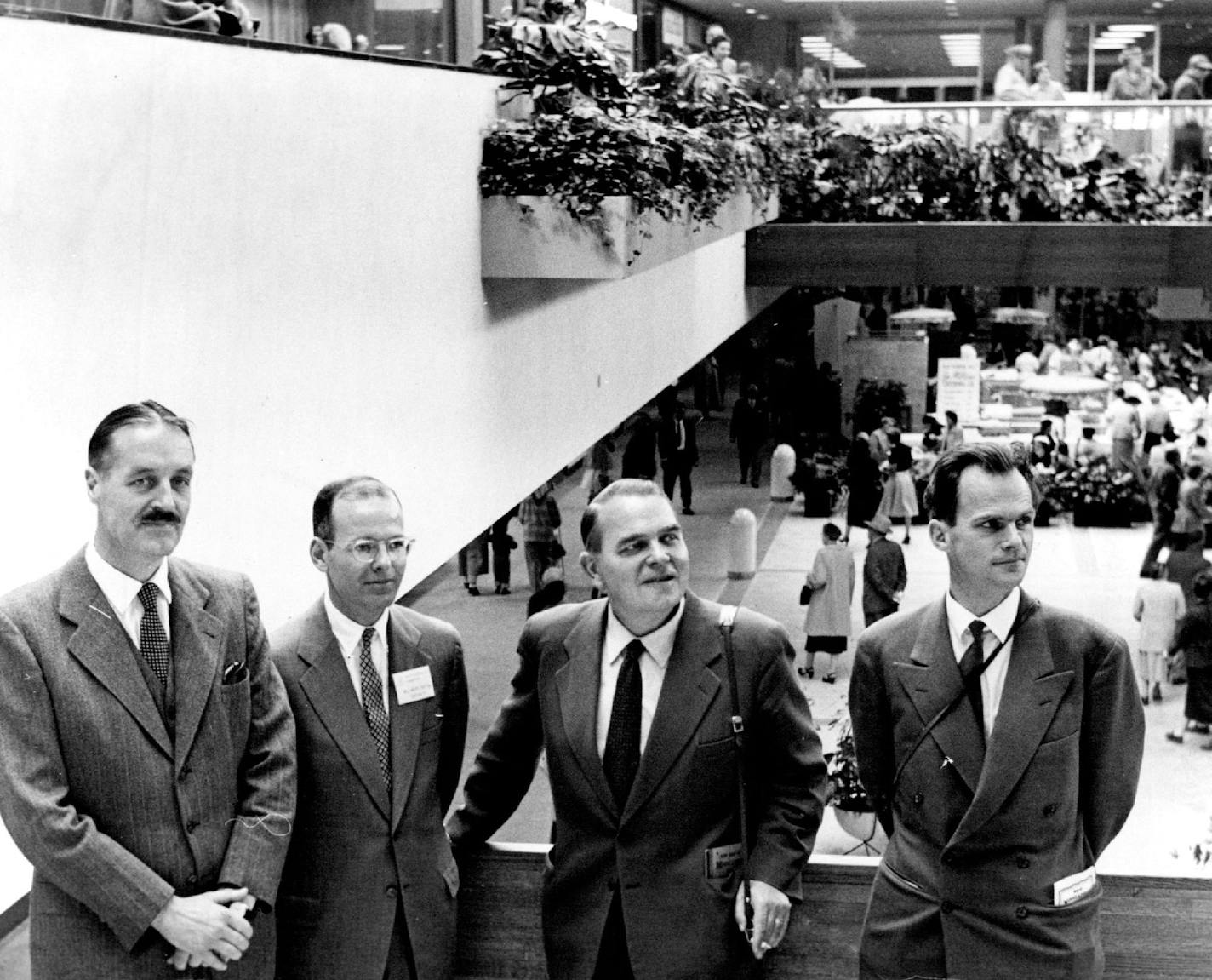 October 9, 1956 Part of The Group from Sweden is shown here taking a look at South dale with Bruce Dayton (second from left) acting as guide. At left is Petersens, Swedish consul in Minneapolis. Others are Torsten Henrlksson '(second from right), city commissioner for housing in Gothenburg, and Erik Sylven, chief traffic engineer of the city planning department in Gothenburg.